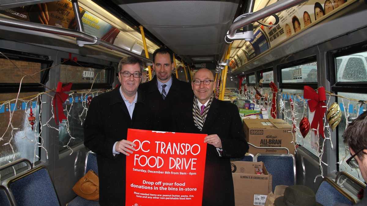Volunteers at the OC Transpo/Loblaw's annual Christmas food drive bus in Ottawa