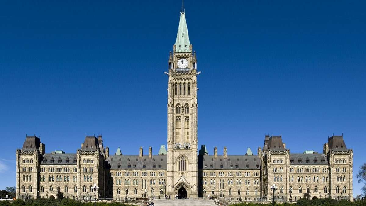 Centre Block and Peace Tower on Parliament Hill, Ottawa, as the Competition Bureau urges provinces to limit non-compete agreements