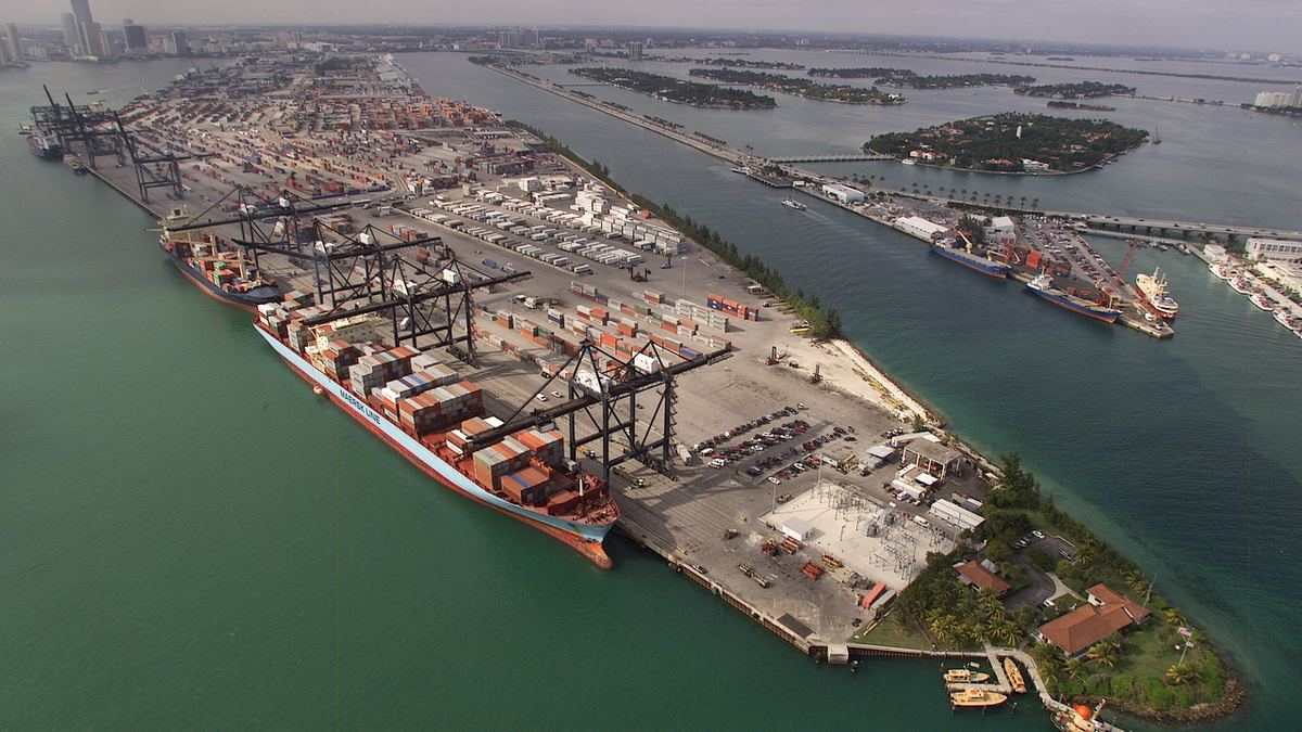 Aerial view of a container port — the lawsuit challenges U.S. tariffs on Canadian imports
