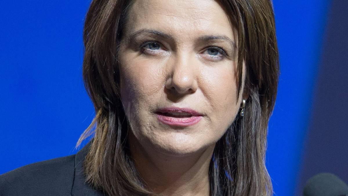Alberta Premier Danielle Smith speaking at a podium